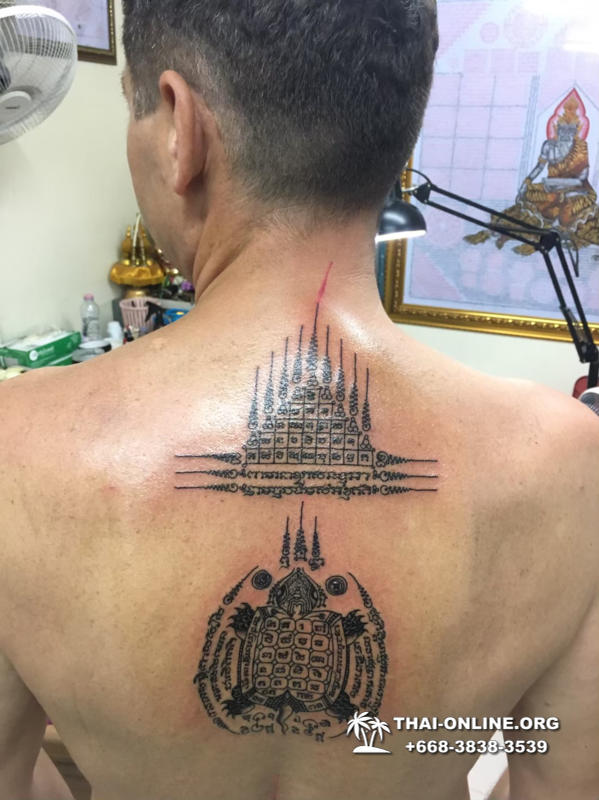 Sak Yant tattoos by Ajarn Dam in Forest Monastery of Wat Bo Thong trip from Pattaya to Rayong with Seven Countries tourist agency Thailand photo 5